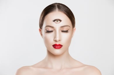 Image of a woman with a tatoo of an eye on her third eye