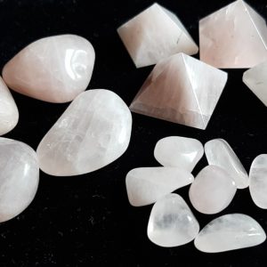 Image of various sizes and shapes of Rose Quartz crystals