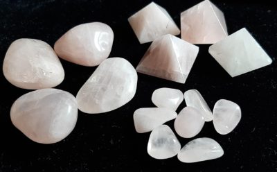 Image of various sizes and shapes of Rose Quartz crystals