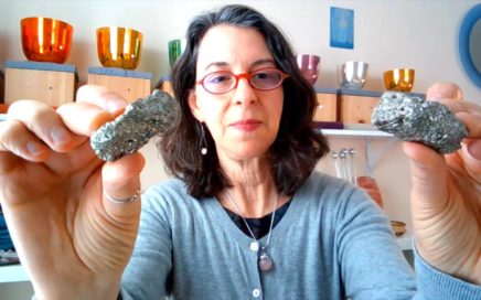Image of Saralee holding 2 Pyrite crystals