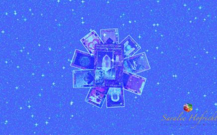 Image of tarot card spread with Saralee Hofrichter logo