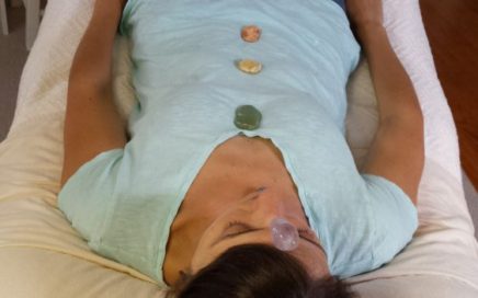 photo of Deb with chakra crystals on her body