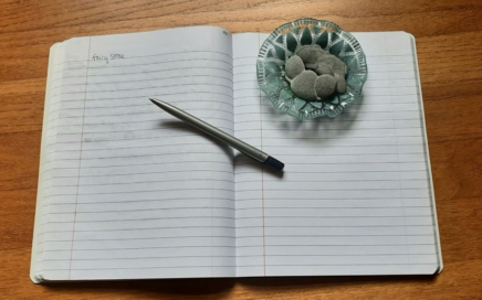 Image of my Crystal Diary notebook, pen and crystals