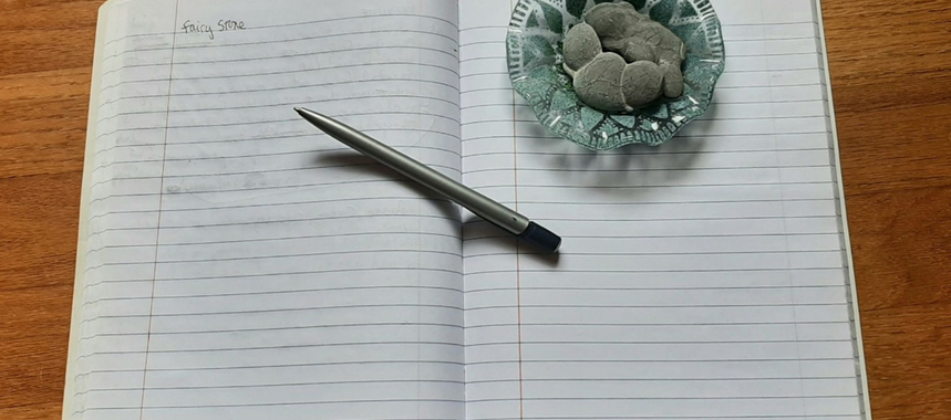 Image of my Crystal Diary notebook, pen and crystals