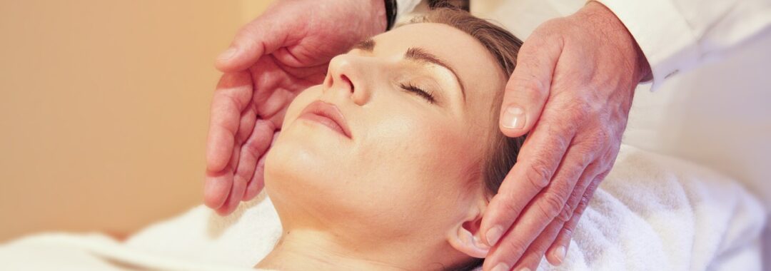 Photo of woman receiving Reiki energy healing