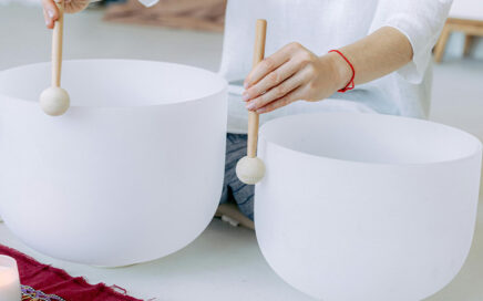 Two white crystal singing bowls.